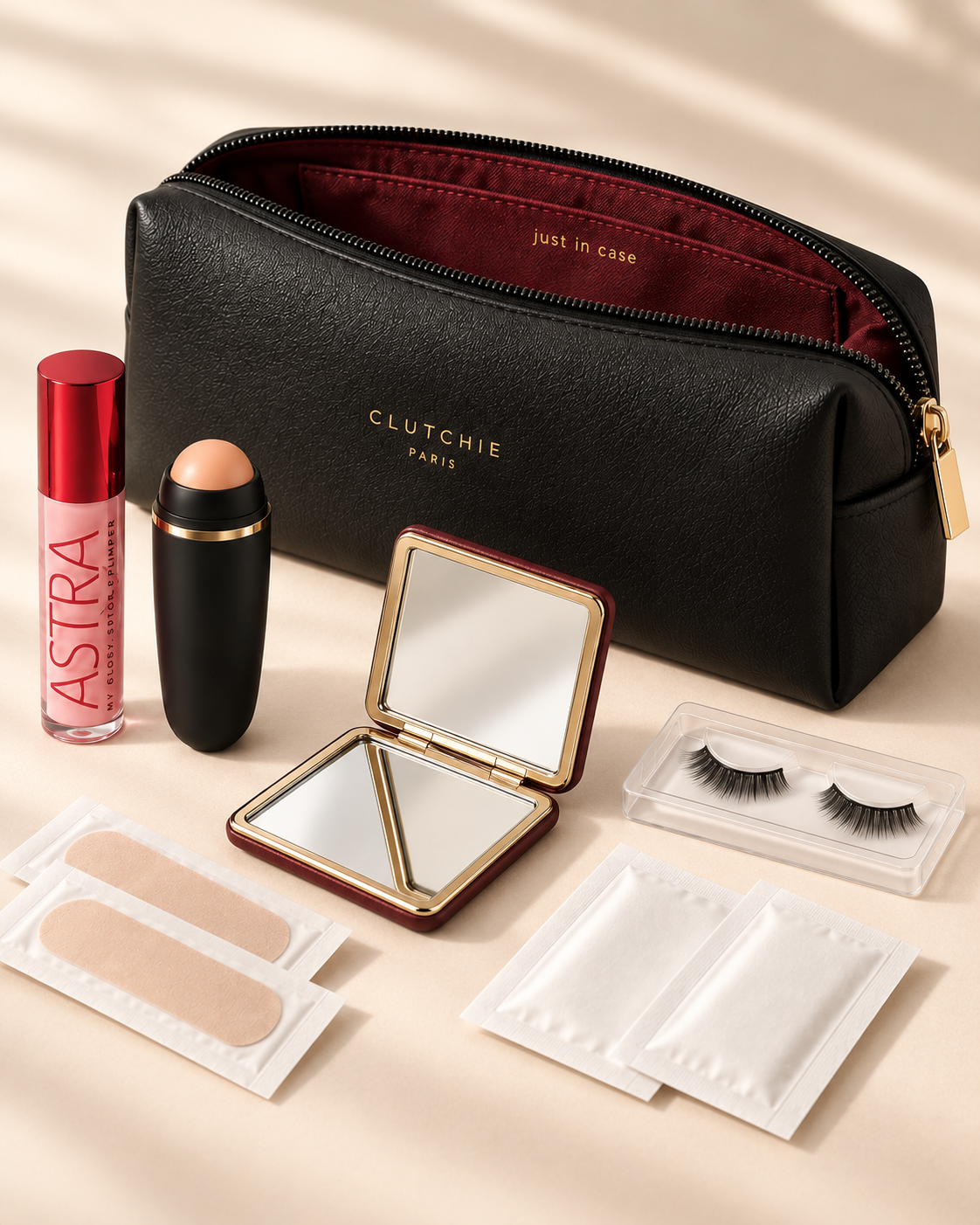 Pochette CLUTCHIE avec gloss, miroir, rouleau matifiant et essentiels de soirée